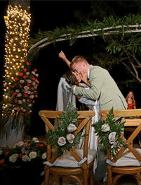 Couple kissing at their wedding ceremony